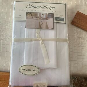 Beautiful white, striped damask tablecloth. 60x120 oblong includes 8 napkins.